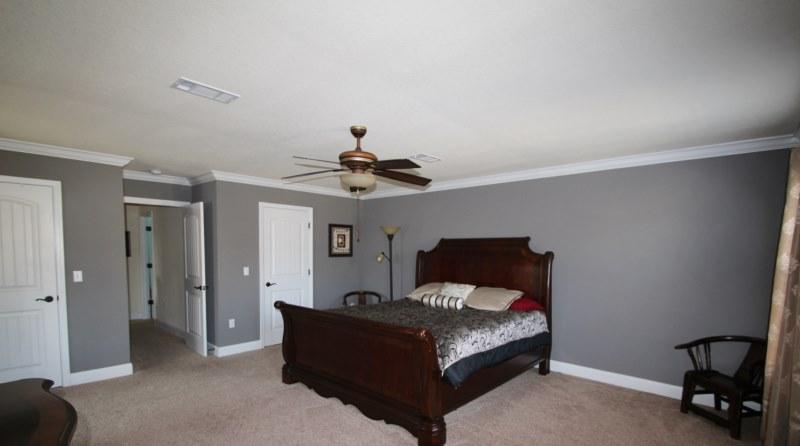 4556 Hermosa Road Crestview, FL 32539 - Photo 35 of 35 a bedroom with a bed and a chandelier