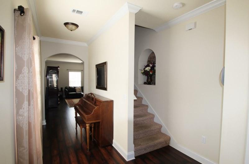 4556 Hermosa Road Crestview, FL 32539 - Photo 10 of 35 a view of entryway and hall with wooden floor