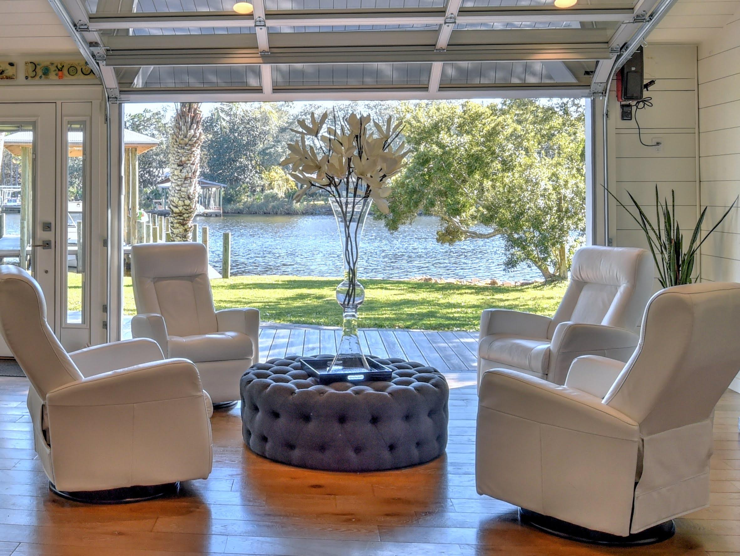 95 Bayou Road Santa Rosa Beach, FL 32459 - Photo 1 of 70 a living room with furniture and a floor to ceiling window