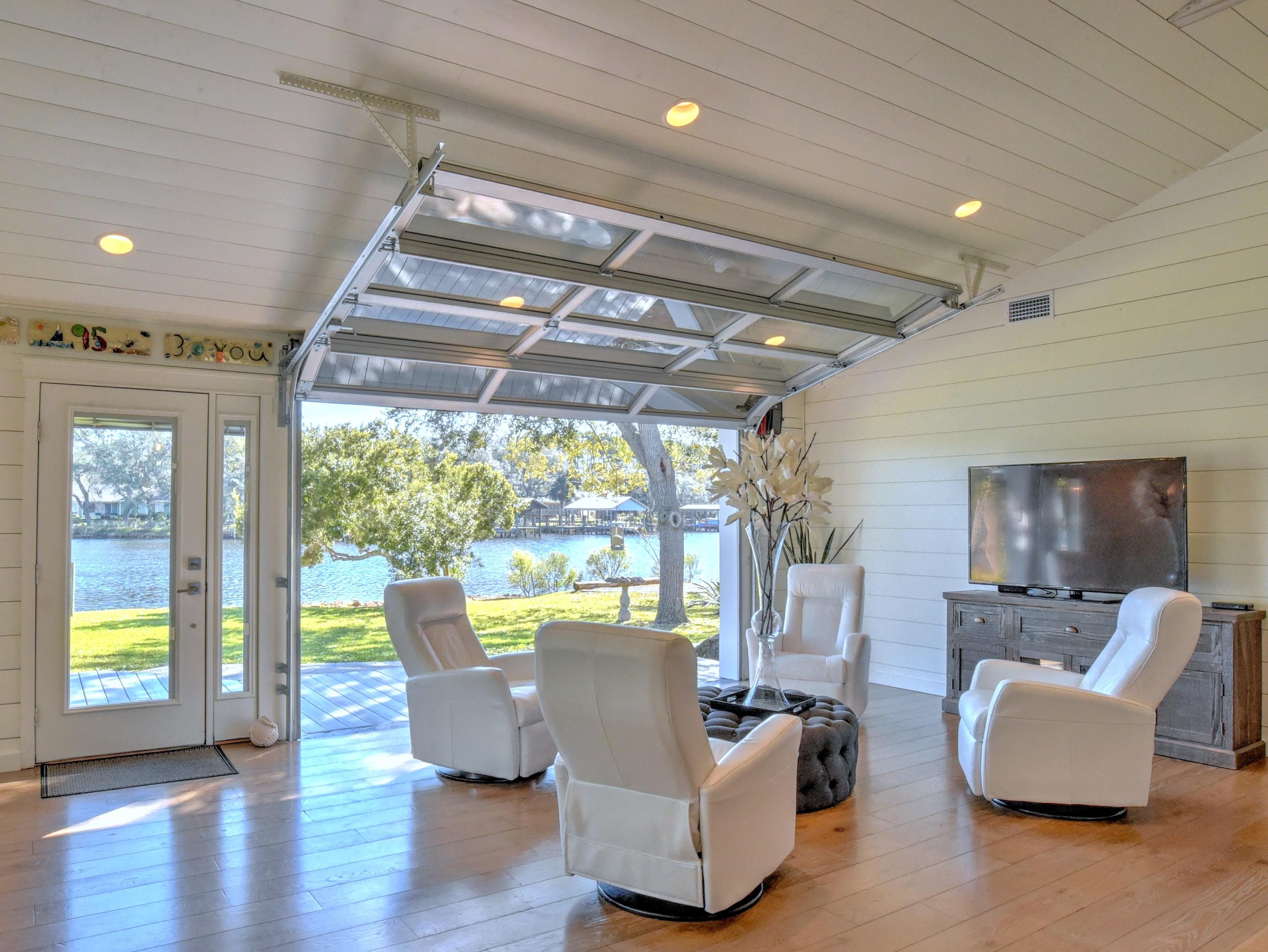 95 Bayou Road Santa Rosa Beach, FL 32459 - Photo 12 of 70 a dining room with furniture a chandelier and wooden floor