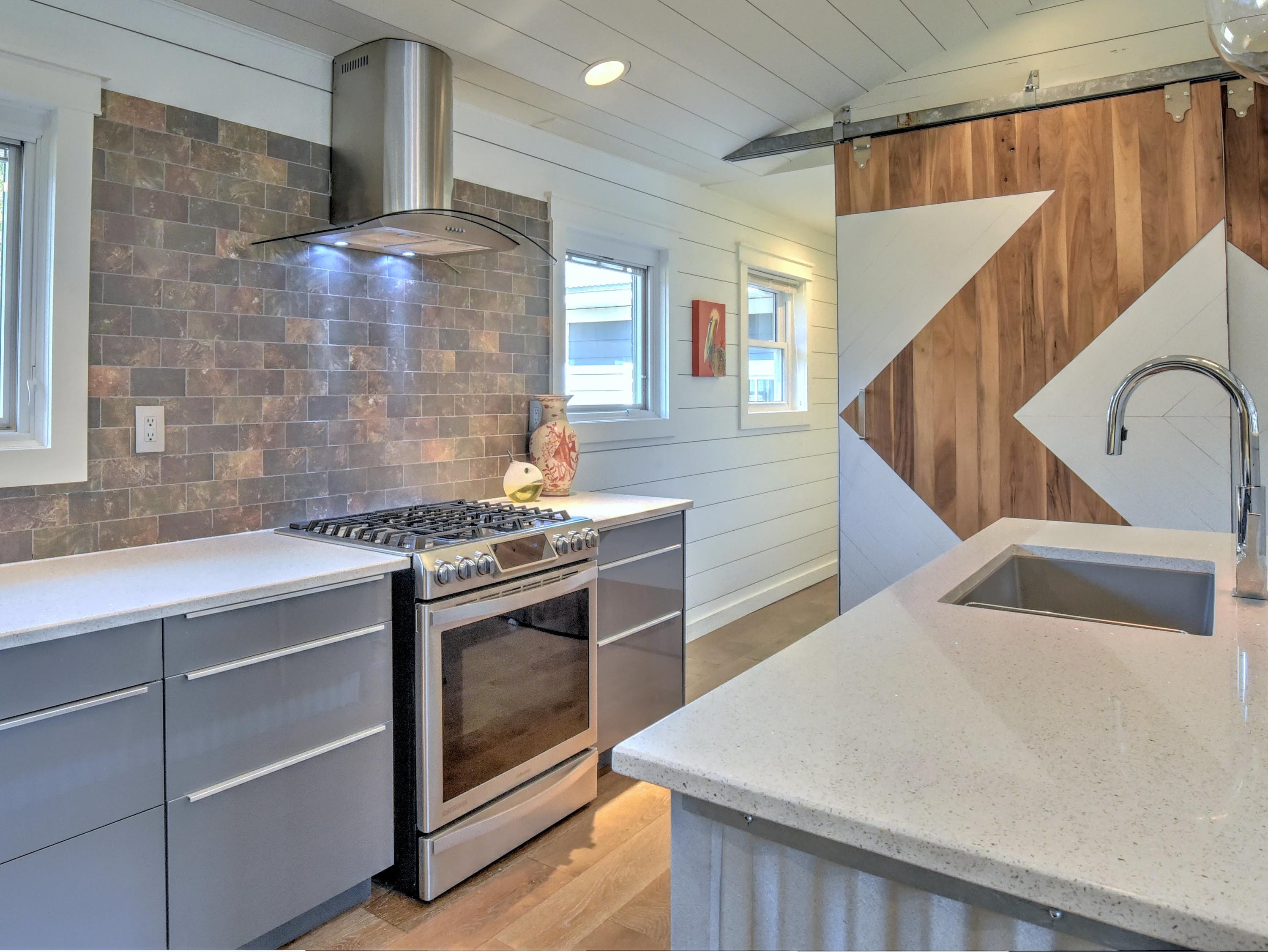95 Bayou Road Santa Rosa Beach, FL 32459 - Photo 21 of 70 a kitchen with a stove and a sink