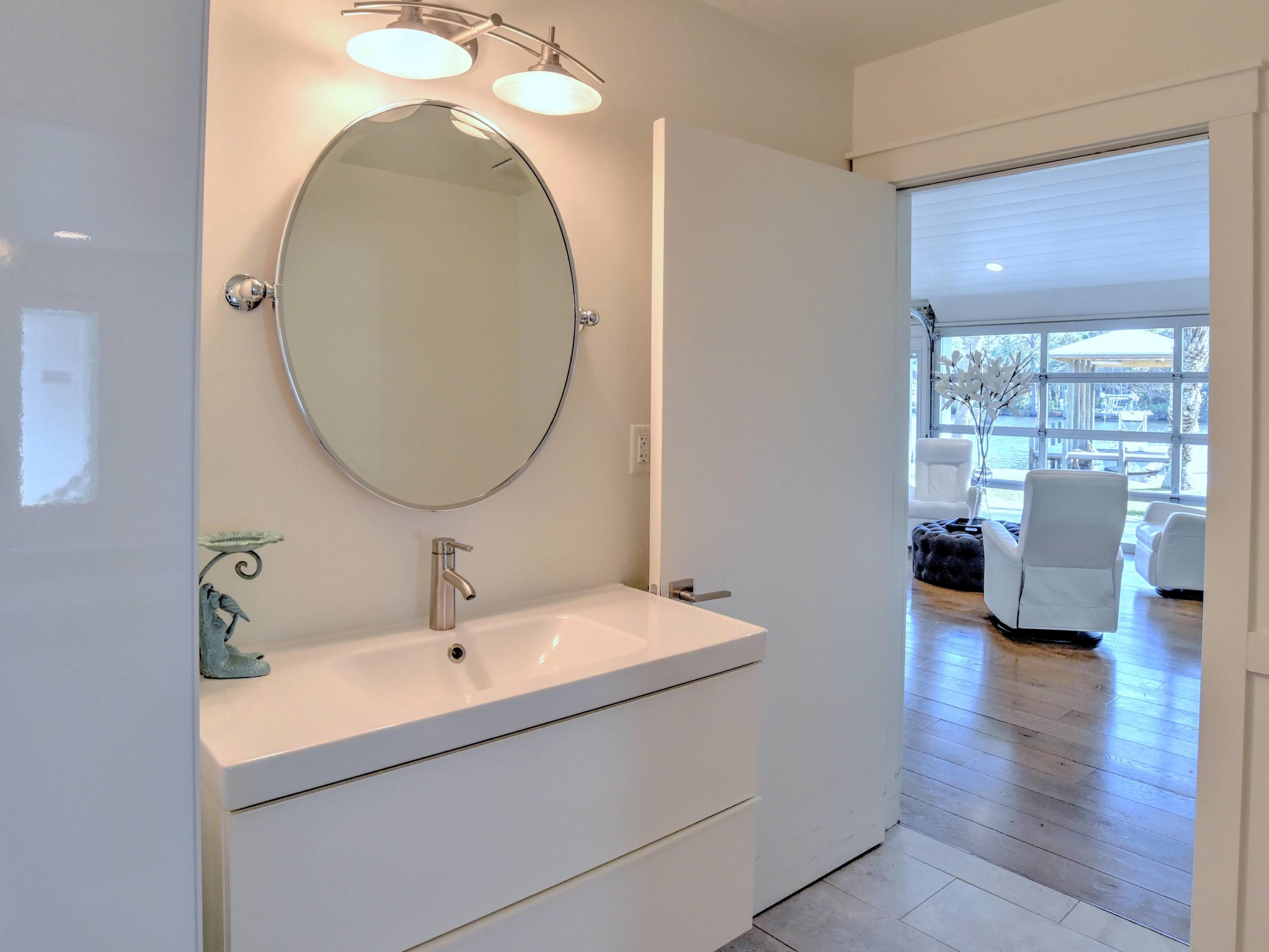 95 Bayou Road Santa Rosa Beach, FL 32459 - Photo 28 of 70 a en suite bathroom with a sink and a mirror