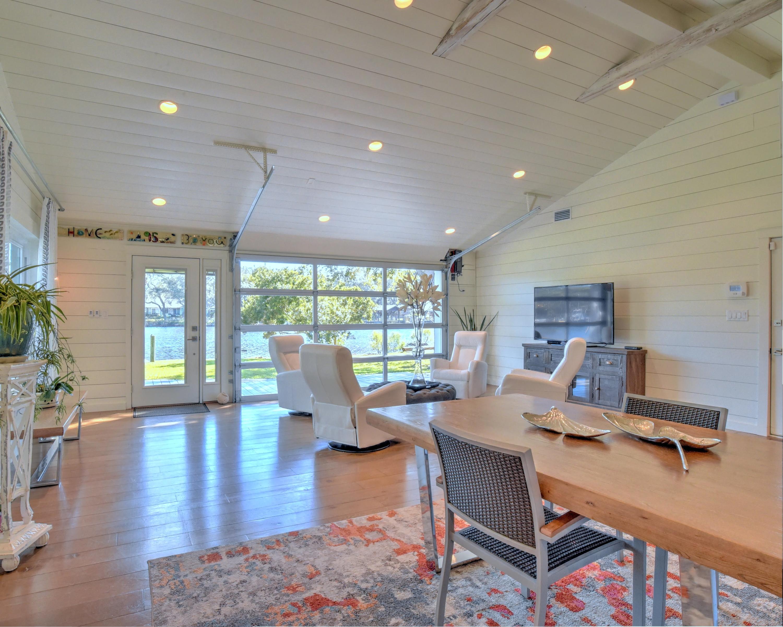 95 Bayou Road Santa Rosa Beach, FL 32459 - Photo 33 of 70 a living room with furniture large window and wooden floor