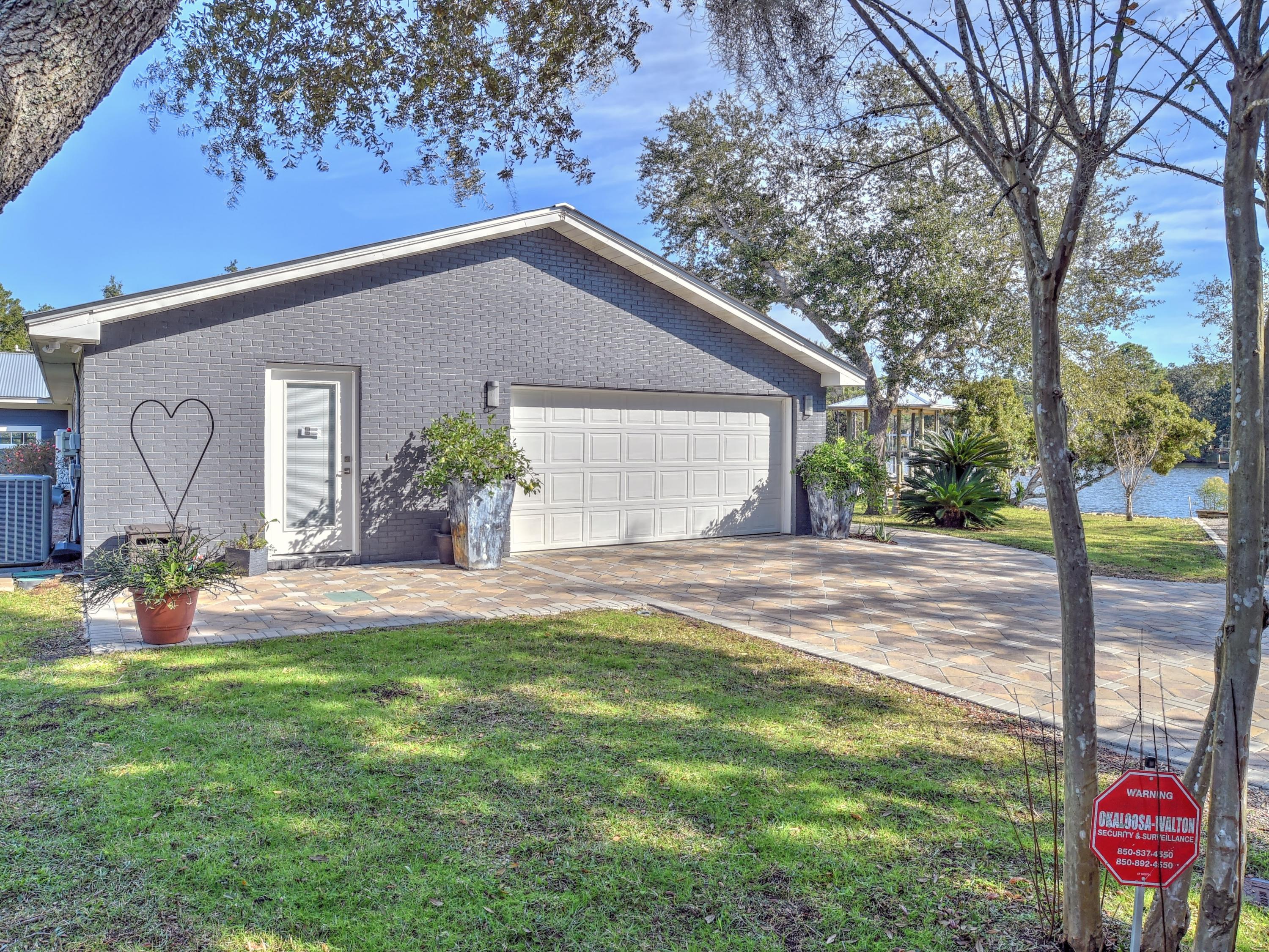 95 Bayou Road Santa Rosa Beach, FL 32459 - Photo 57 of 70 a view of a house with backyard and garden
