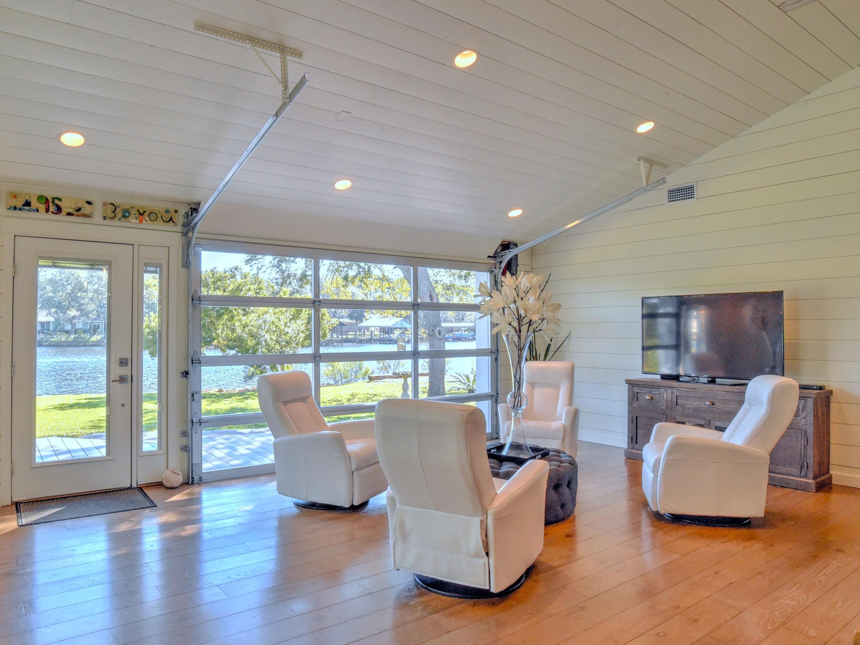 95 Bayou Road Santa Rosa Beach, FL 32459 - Photo 8 of 70 a living room with fireplace furniture and a large window