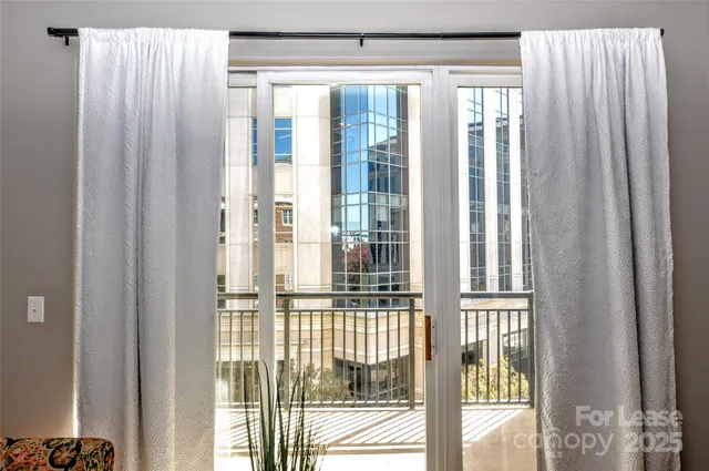 a view of a window with wooden floor