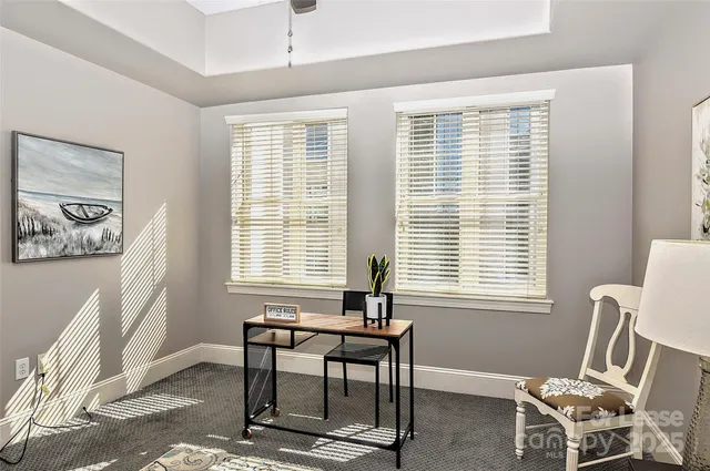 a workspace with furniture and a window