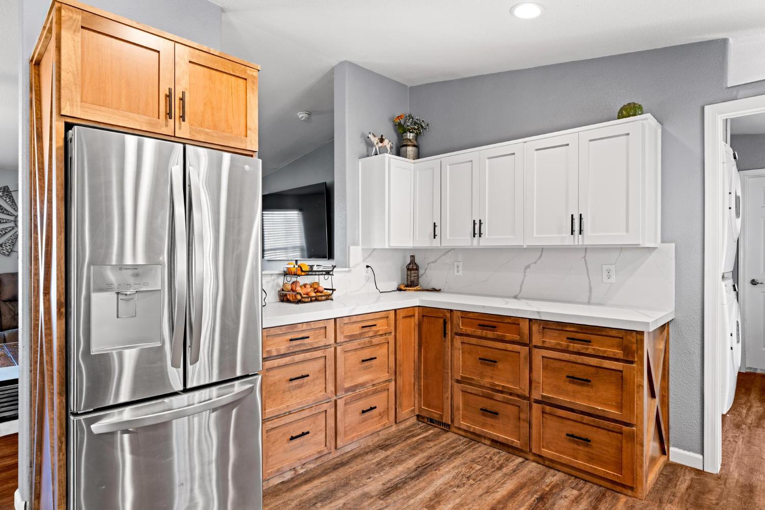 12518 Lone Oak Road Waterford, CA 95386 - Photo 15 of 50 a kitchen with stainless steel appliances granite countertop a refrigerator and a stove top oven