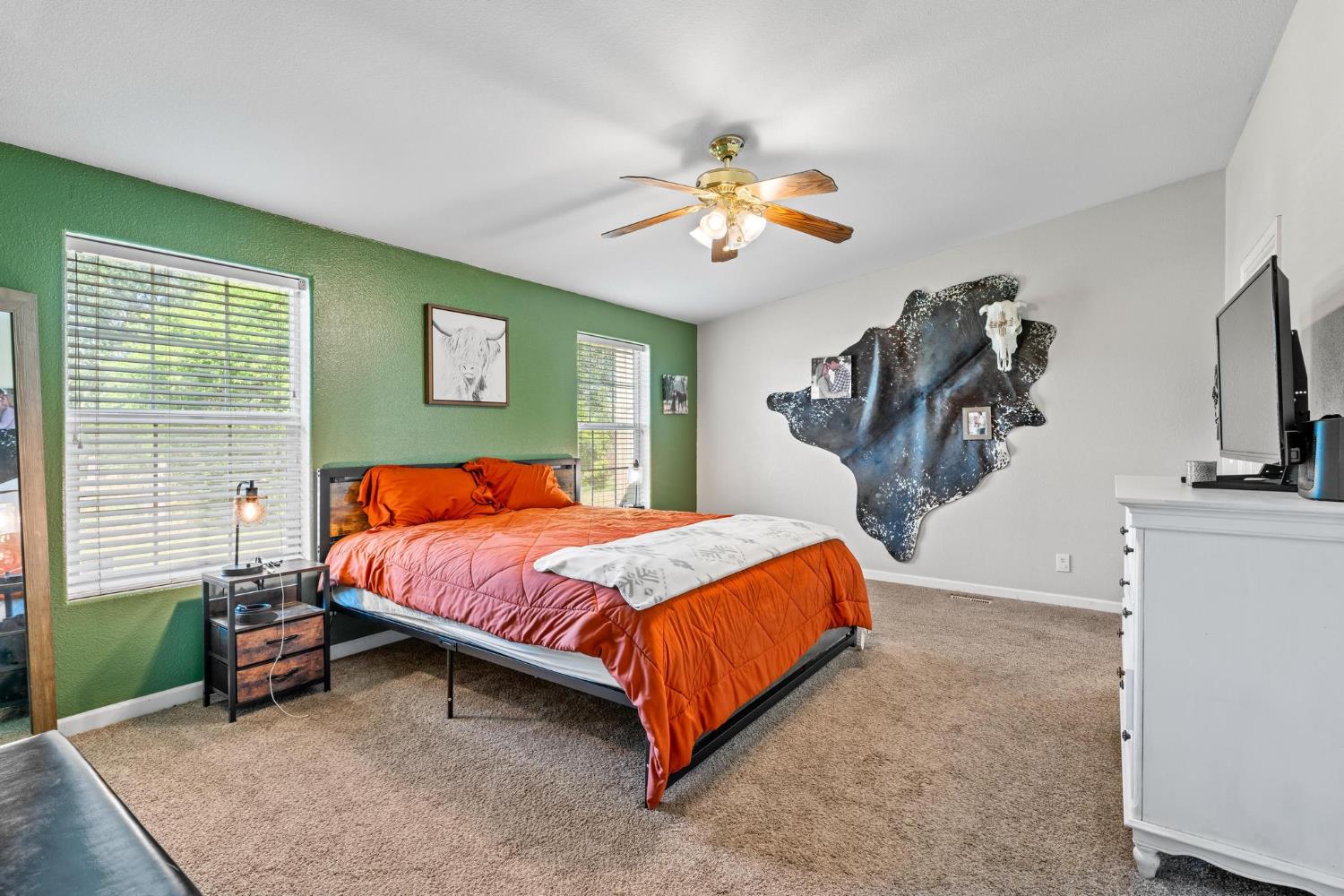 12518 Lone Oak Road Waterford, CA 95386 - Photo 19 of 50 a bedroom with a bed and a chandelier