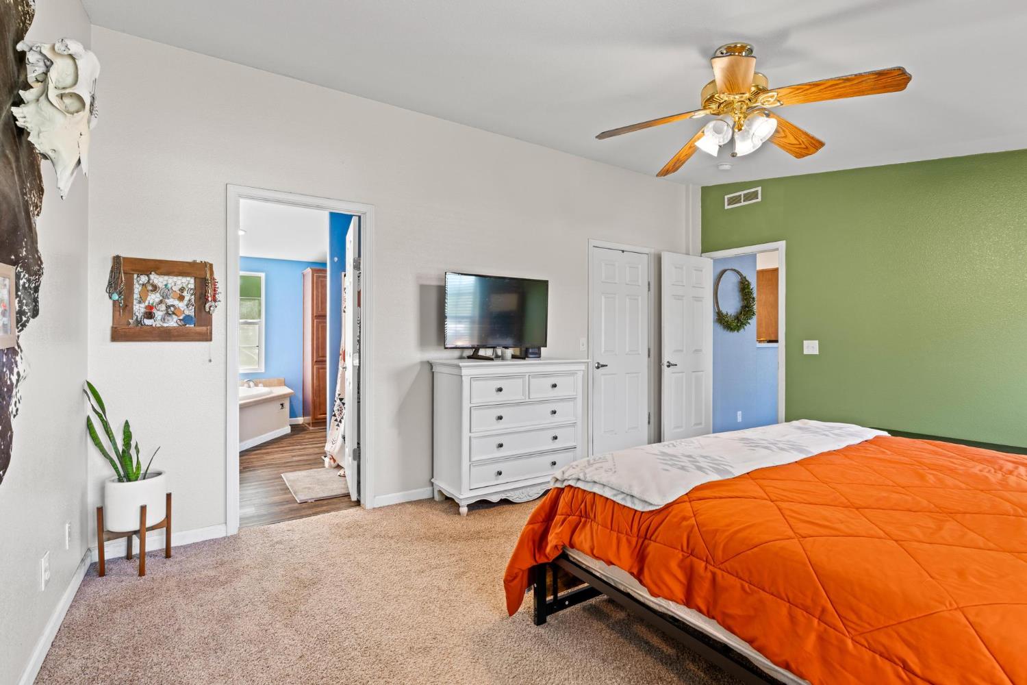 12518 Lone Oak Road Waterford, CA 95386 - Photo 20 of 50 a bedroom with a bed and flat screen tv