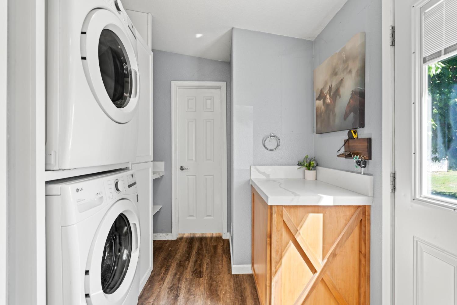 12518 Lone Oak Road Waterford, CA 95386 - Photo 27 of 50 a bathroom with a sink mirror and window