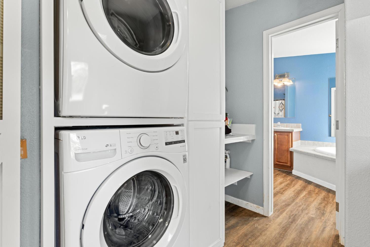 12518 Lone Oak Road Waterford, CA 95386 - Photo 28 of 50 a view of a hallway with washer and dryer