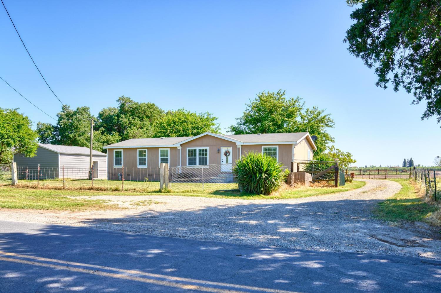 12518 Lone Oak Road Waterford, CA 95386 - Photo 3 of 50 a view of a house with swimming pool