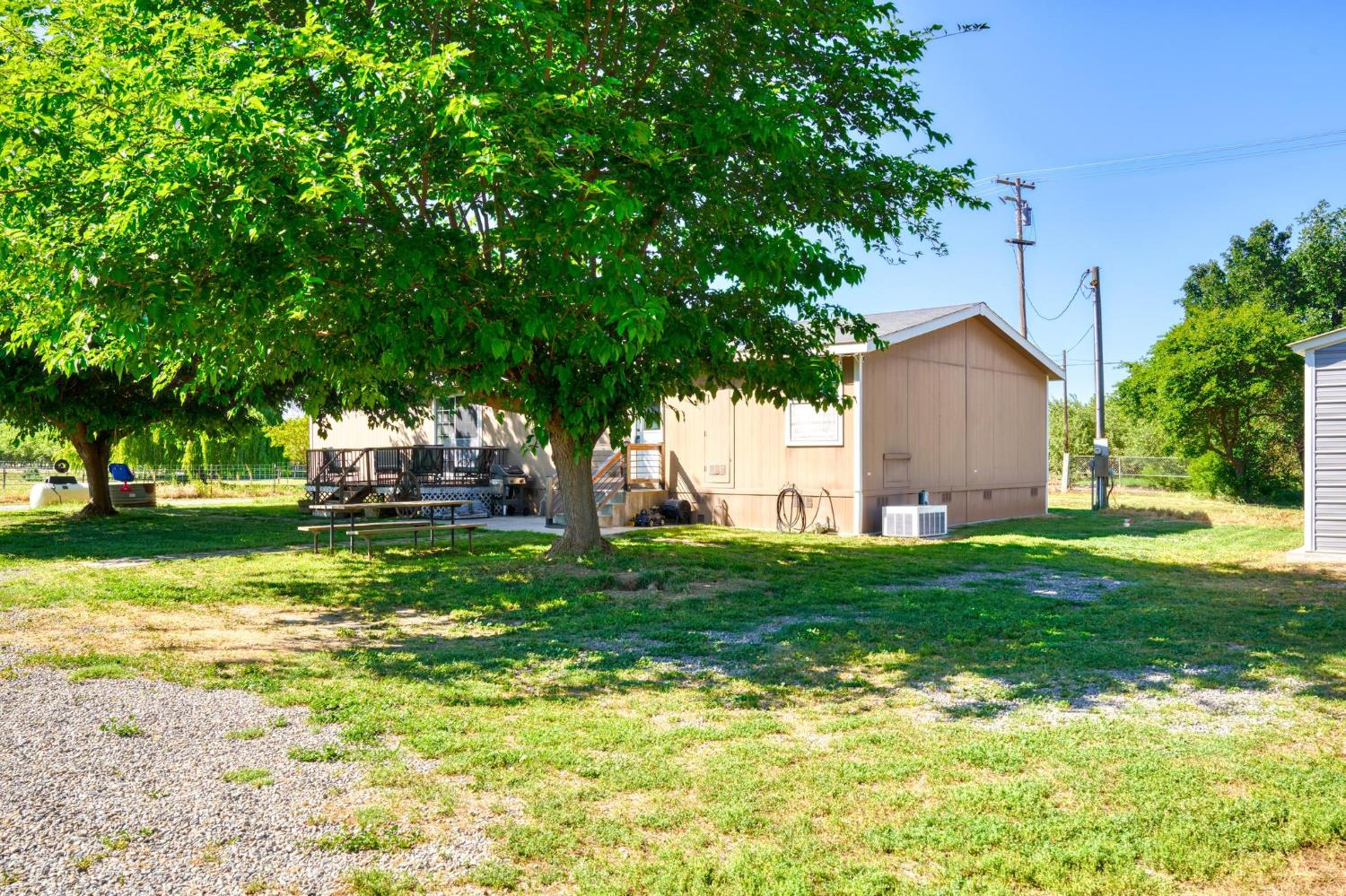 12518 Lone Oak Road Waterford, CA 95386 - Photo 32 of 50 a view of a house with backyard and garden