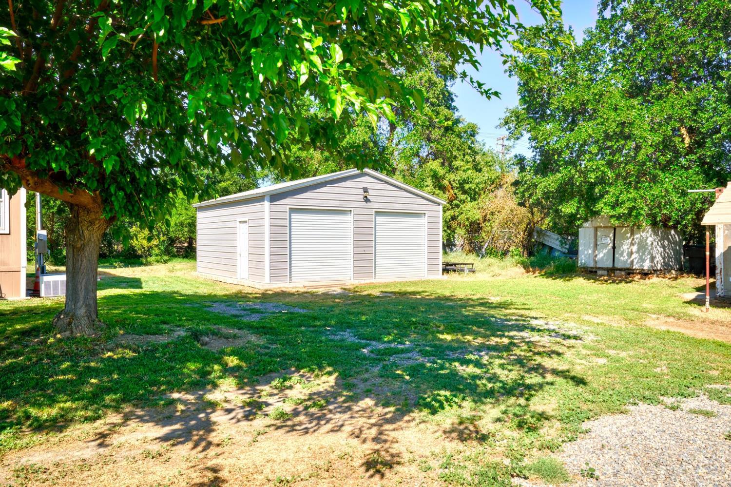 12518 Lone Oak Road Waterford, CA 95386 - Photo 33 of 50 a view of a house with a backyard