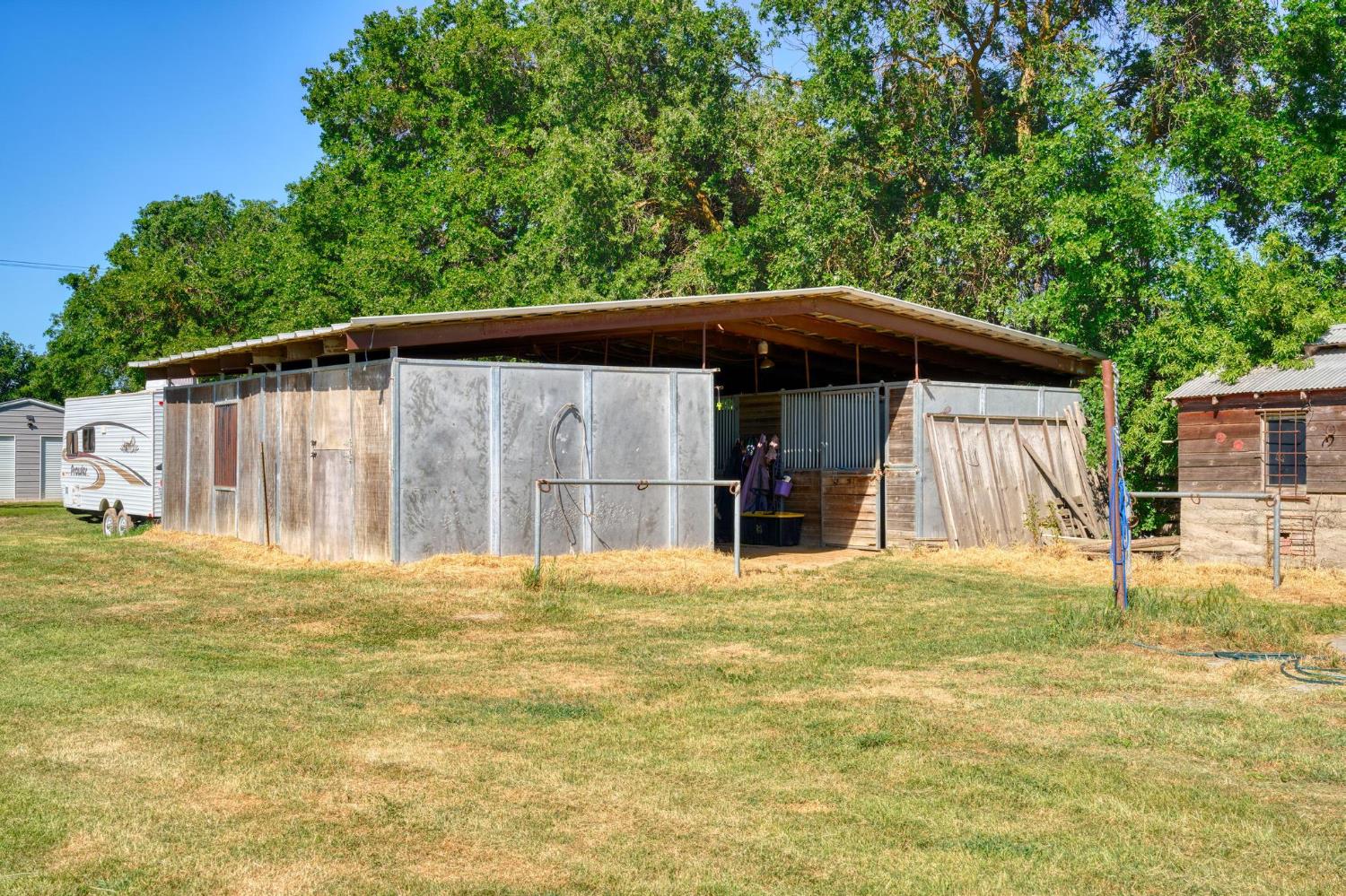 12518 Lone Oak Road Waterford, CA 95386 - Photo 45 of 50 a front view of a house with a garden