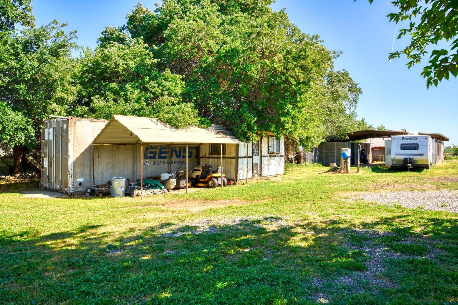 12518 Lone Oak Road Waterford, CA 95386 - Photo 48 of 50 a house view with a sitting space and garden