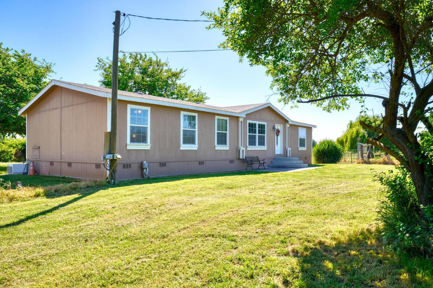 12518 Lone Oak Road Waterford, CA 95386 - Photo 5 of 50 a house view with a garden space