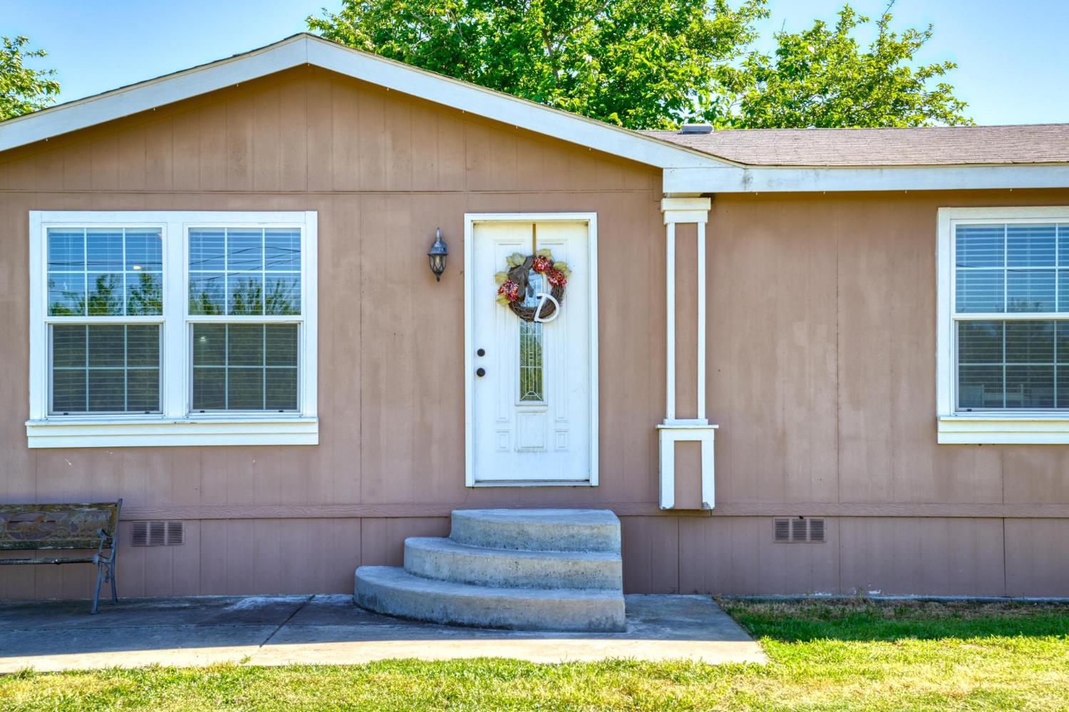 12518 Lone Oak Road Waterford, CA 95386 - Photo 8 of 50 a front view of a house with a yard