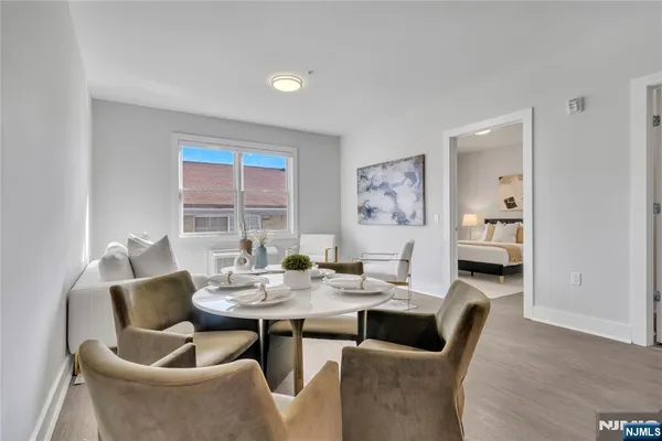 a dining room with furniture and window