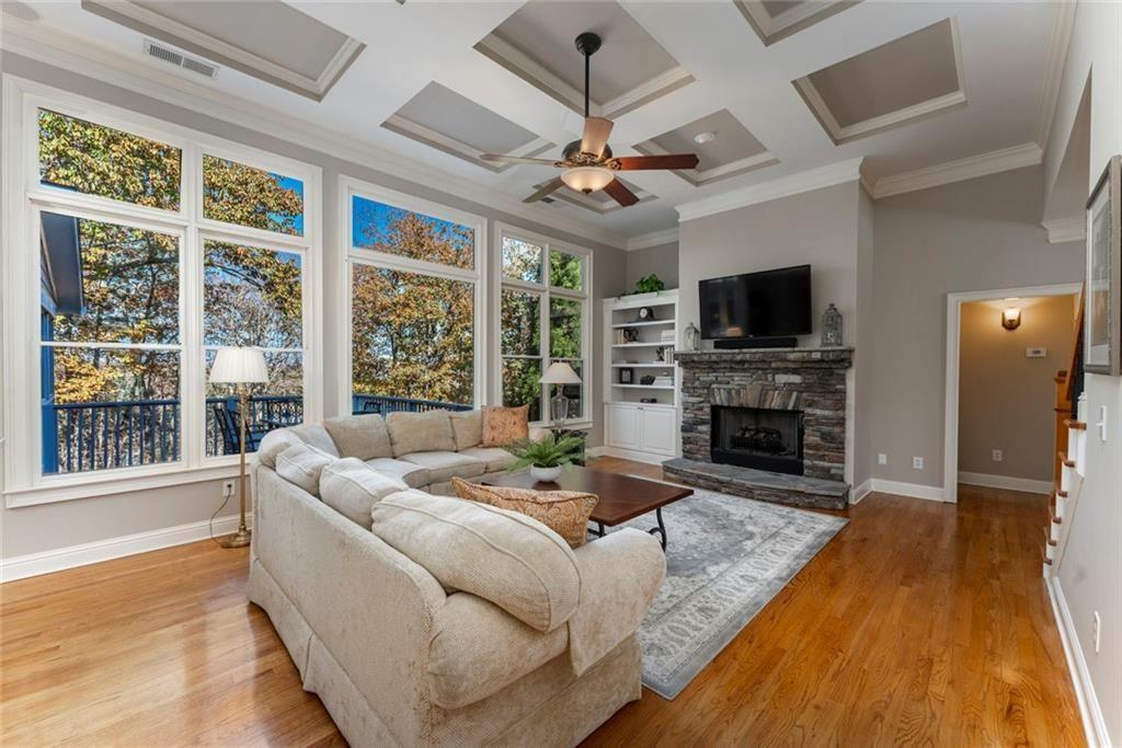 300 Tupelo Trail Canton, GA 30114 - Photo 12 of 50 a living room with fireplace furniture and a flat screen tv