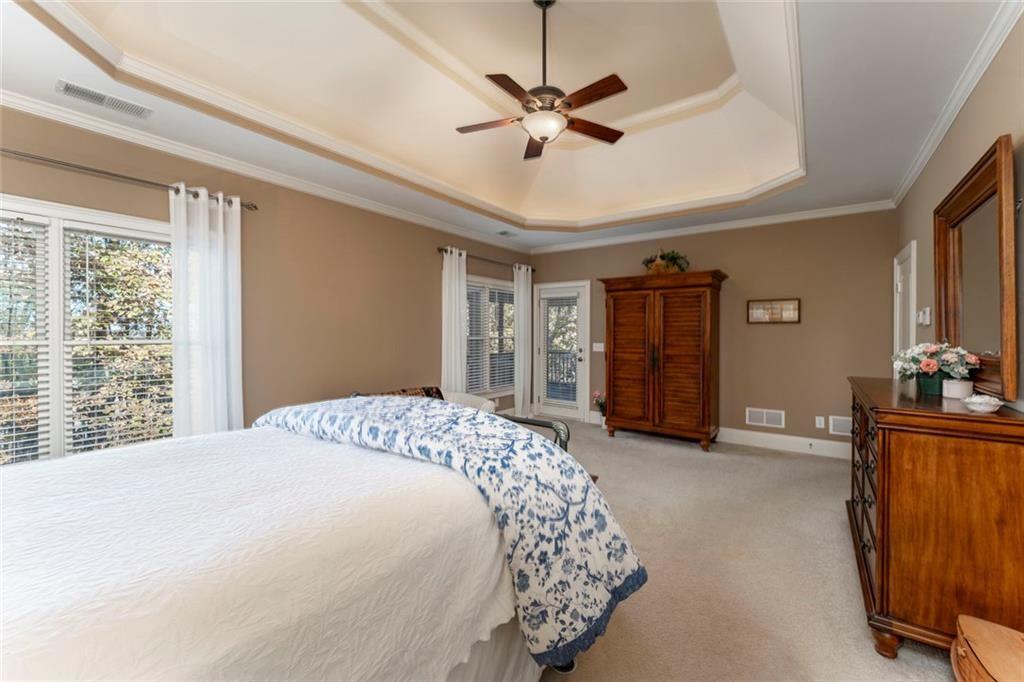 300 Tupelo Trail Canton, GA 30114 - Photo 22 of 50 a bedroom with a bed dresser and a window