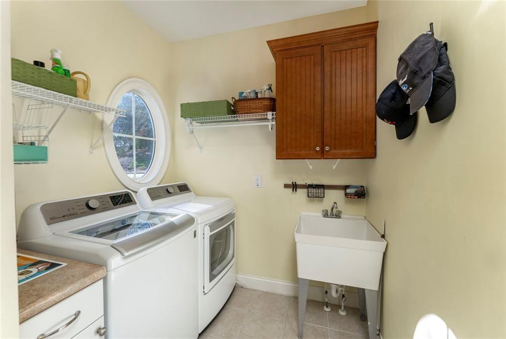 300 Tupelo Trail Canton, GA 30114 - Photo 25 of 50 a room with a sink and cabinets