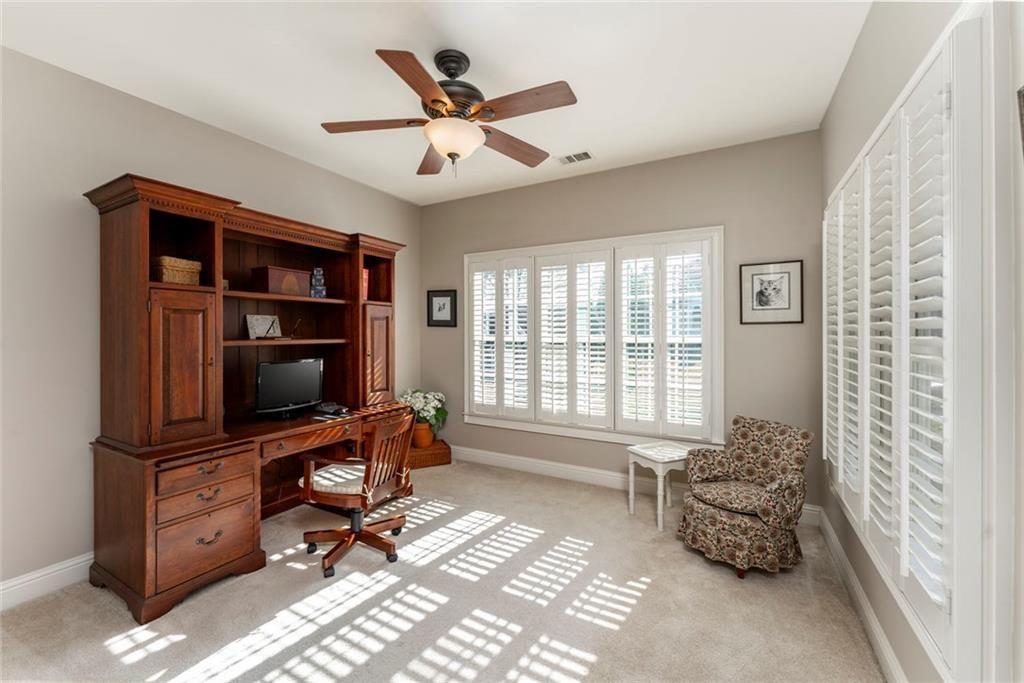 300 Tupelo Trail Canton, GA 30114 - Photo 27 of 50 a living room with furniture and a flat screen tv