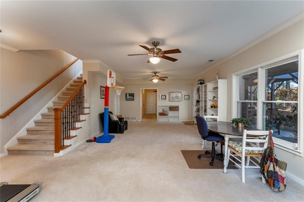 300 Tupelo Trail Canton, GA 30114 - Photo 32 of 50 a view of a livingroom with furniture and a ceiling fan