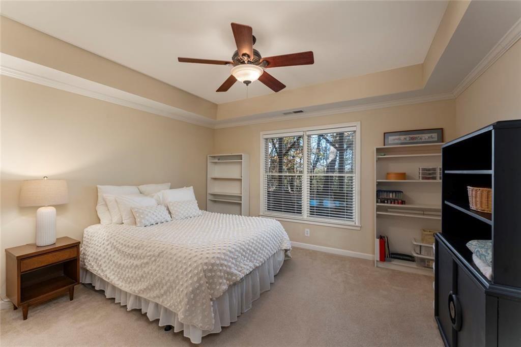 300 Tupelo Trail Canton, GA 30114 - Photo 35 of 50 a bedroom with a large bed and a window