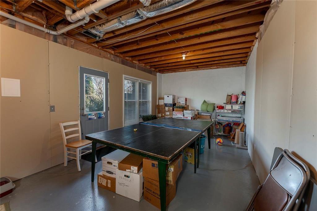 300 Tupelo Trail Canton, GA 30114 - Photo 37 of 50 a room with furniture a rug and a window