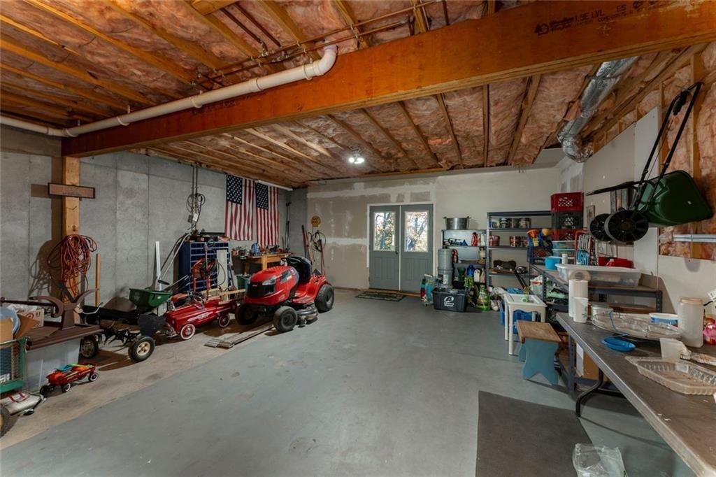 300 Tupelo Trail Canton, GA 30114 - Photo 38 of 50 a view of a storage room with gym equipment