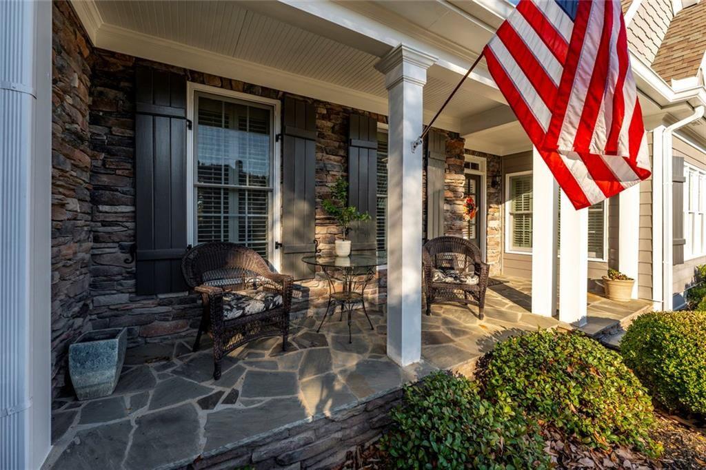 300 Tupelo Trail Canton, GA 30114 - Photo 6 of 50 a front view of a house with outdoor seating