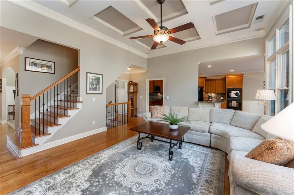 300 Tupelo Trail Canton, GA 30114 - Photo 10 of 50 a living room with furniture and a chandelier