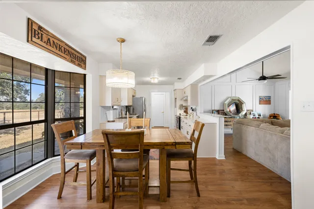 a view of a livingroom with furniture and wooden floor