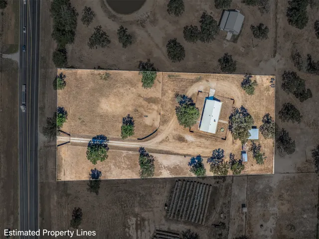an aerial view of residential house with outdoor space