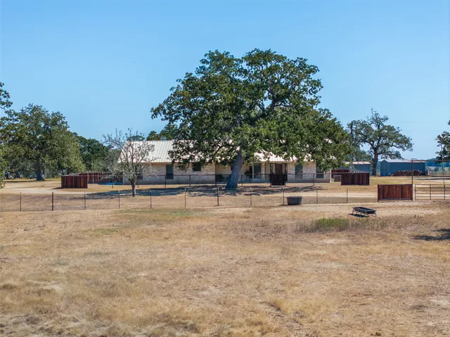 a view of a swimming pool with a yard