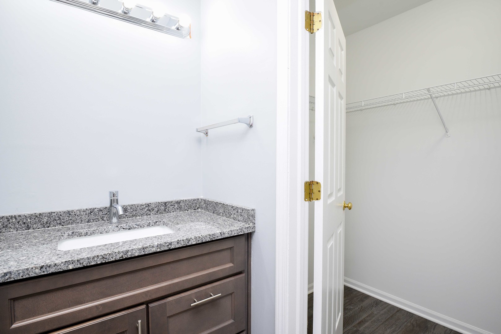 1032 Ripple Ridge, Unit 19 Darien, IL 60561 - Photo 11 of 28 a bathroom with a granite countertop sink and a mirror