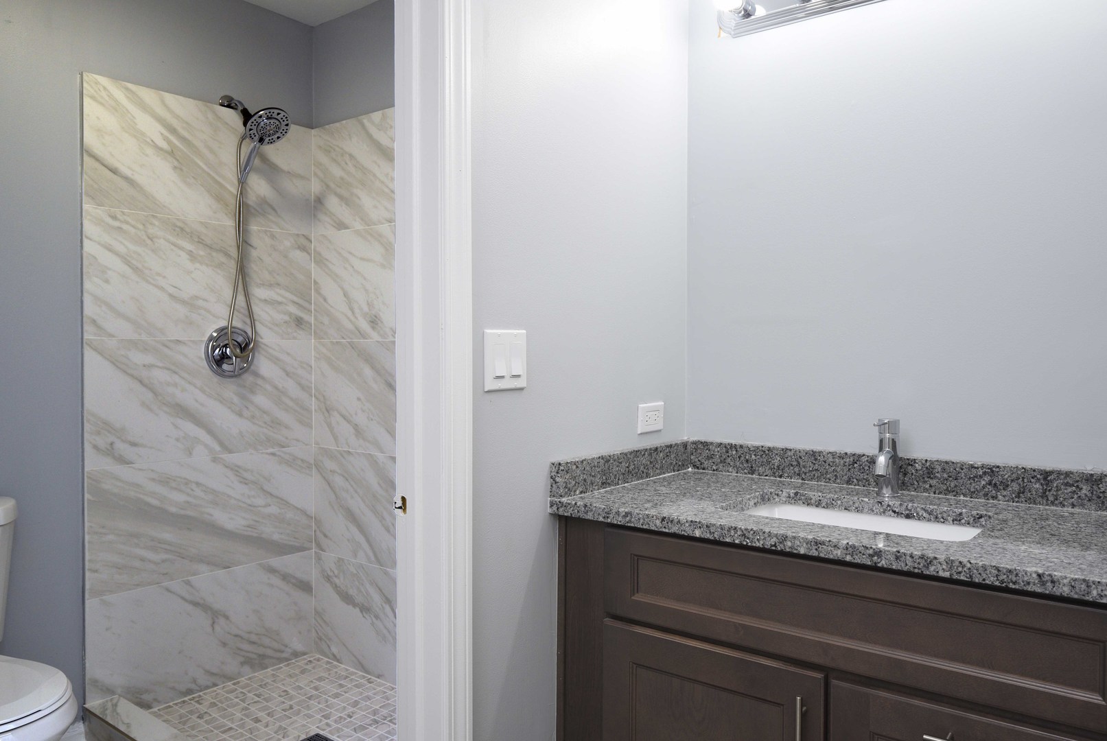 1032 Ripple Ridge, Unit 19 Darien, IL 60561 - Photo 13 of 28 a bathroom with a granite countertop sink and a mirror