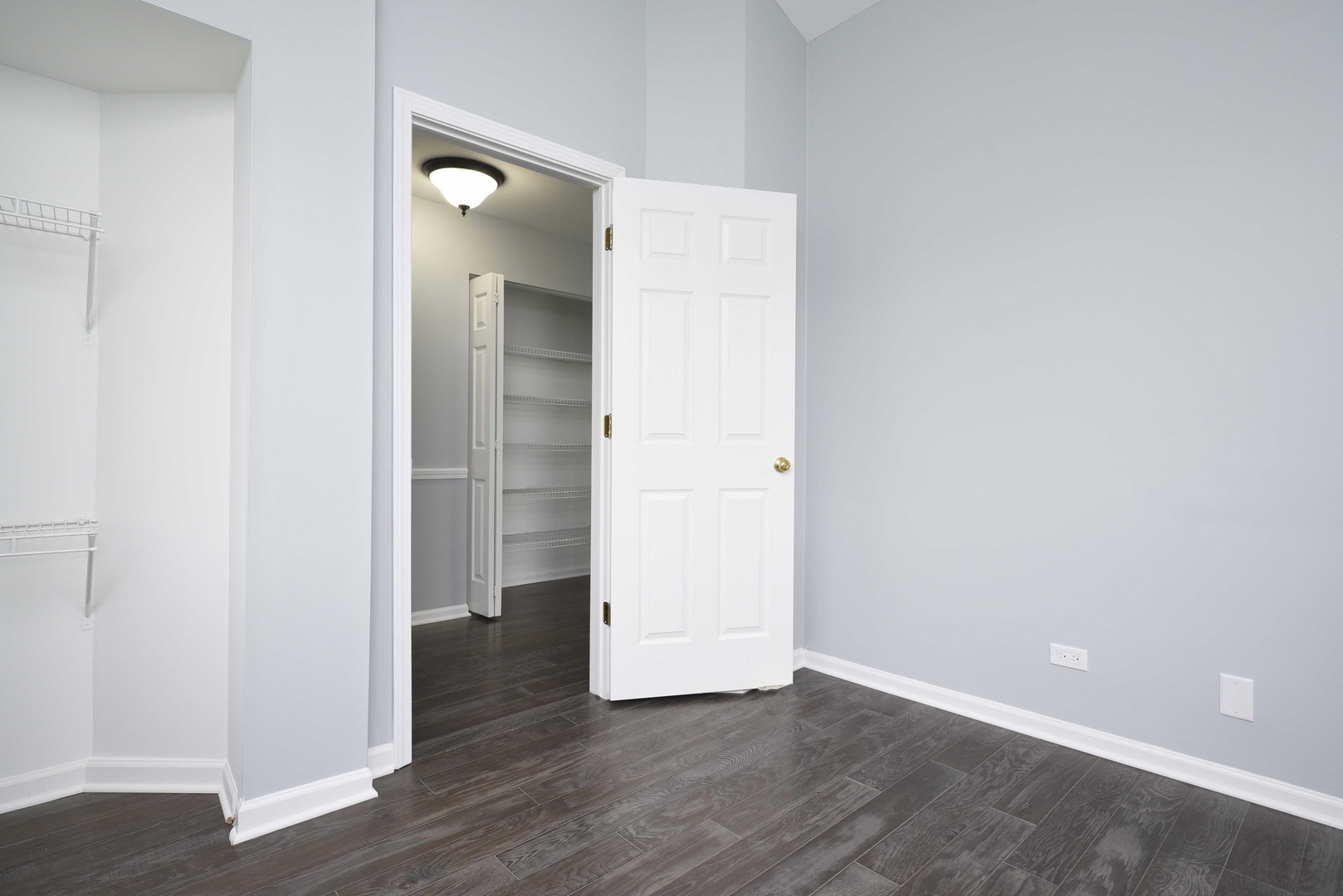 1032 Ripple Ridge, Unit 19 Darien, IL 60561 - Photo 19 of 28 an empty room with wooden floor and entrance