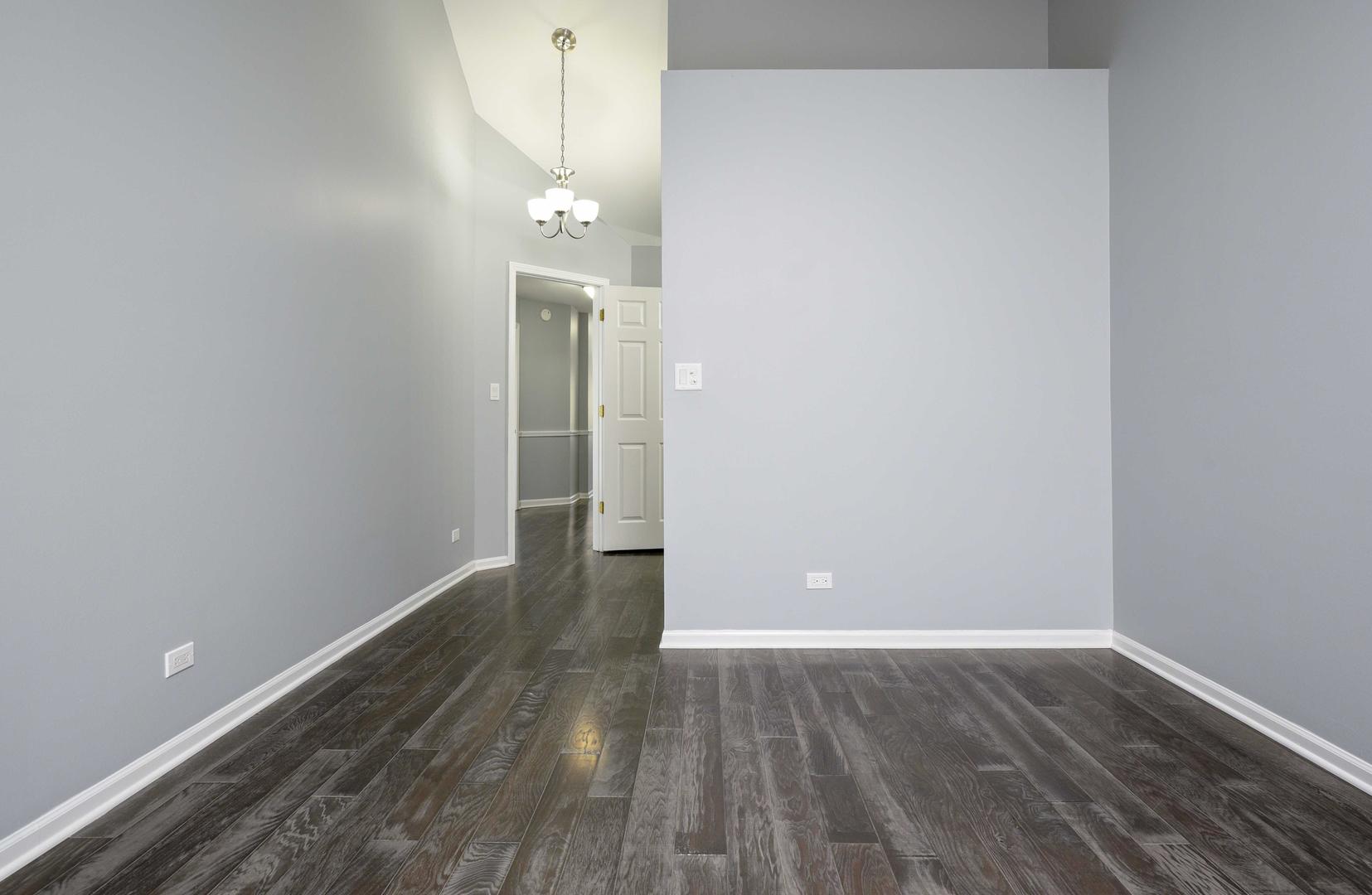 1032 Ripple Ridge, Unit 19 Darien, IL 60561 - Photo 22 of 28 wooden floor in an empty room