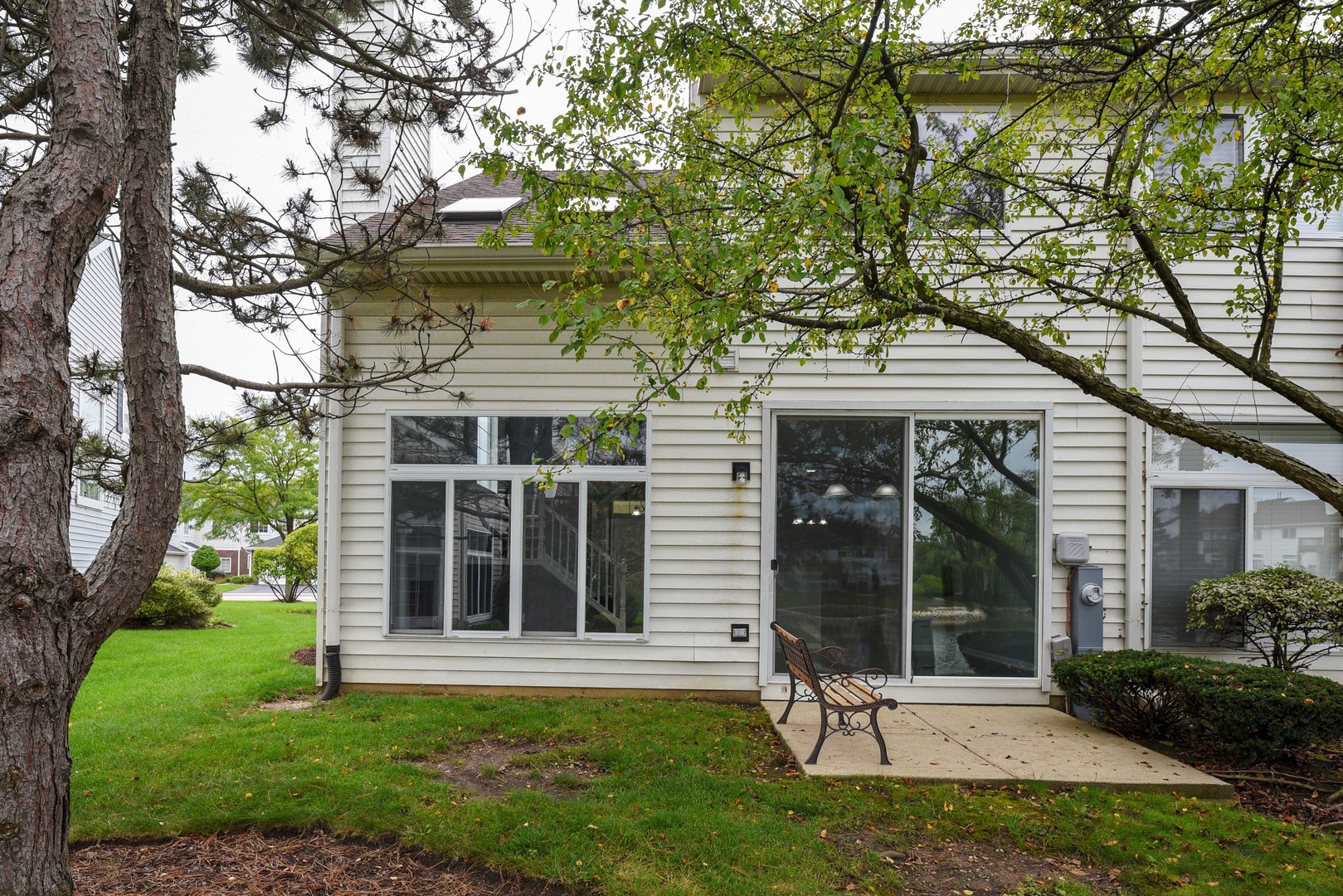 1032 Ripple Ridge, Unit 19 Darien, IL 60561 - Photo 26 of 28 front view of a house with a yard