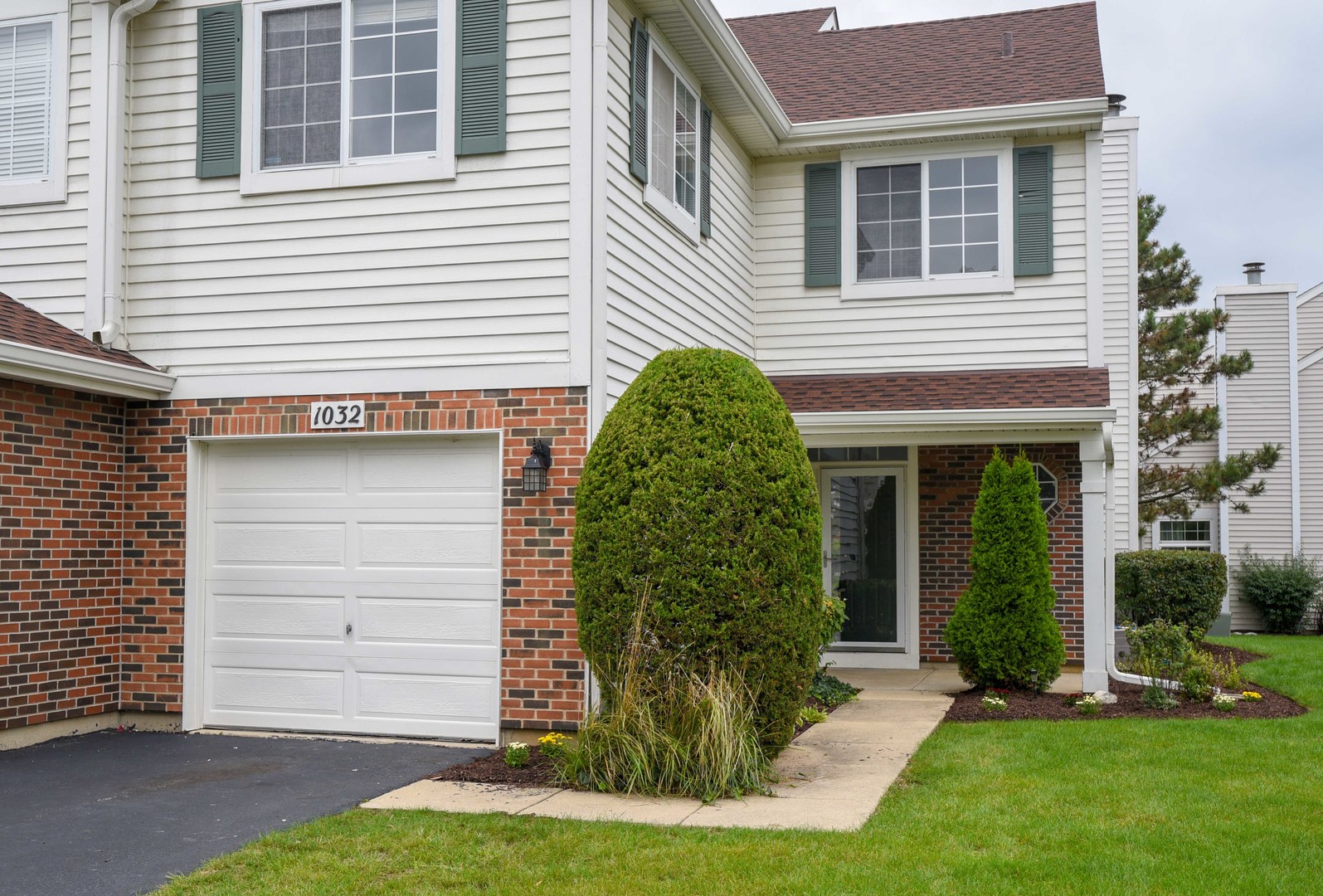 1032 Ripple Ridge, Unit 19 Darien, IL 60561 - Photo 28 of 28 a front view of a house with a yard