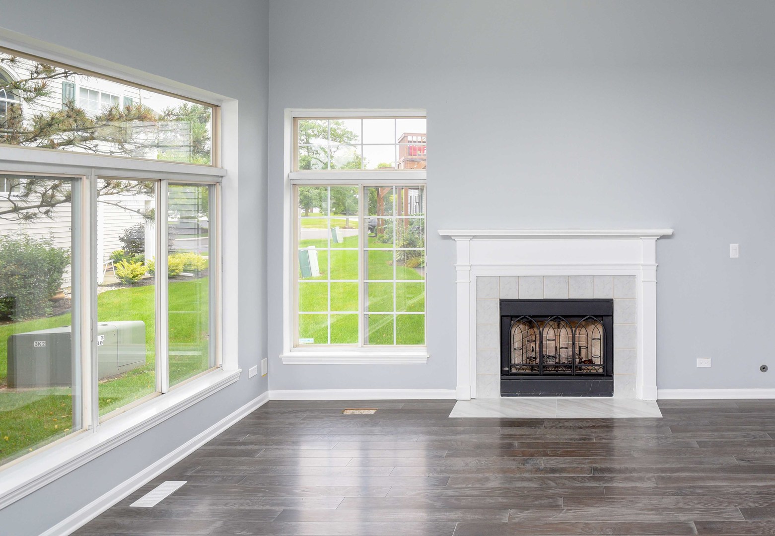 1032 Ripple Ridge, Unit 19 Darien, IL 60561 - Photo 5 of 28 a view of an empty room with a fireplace and a window