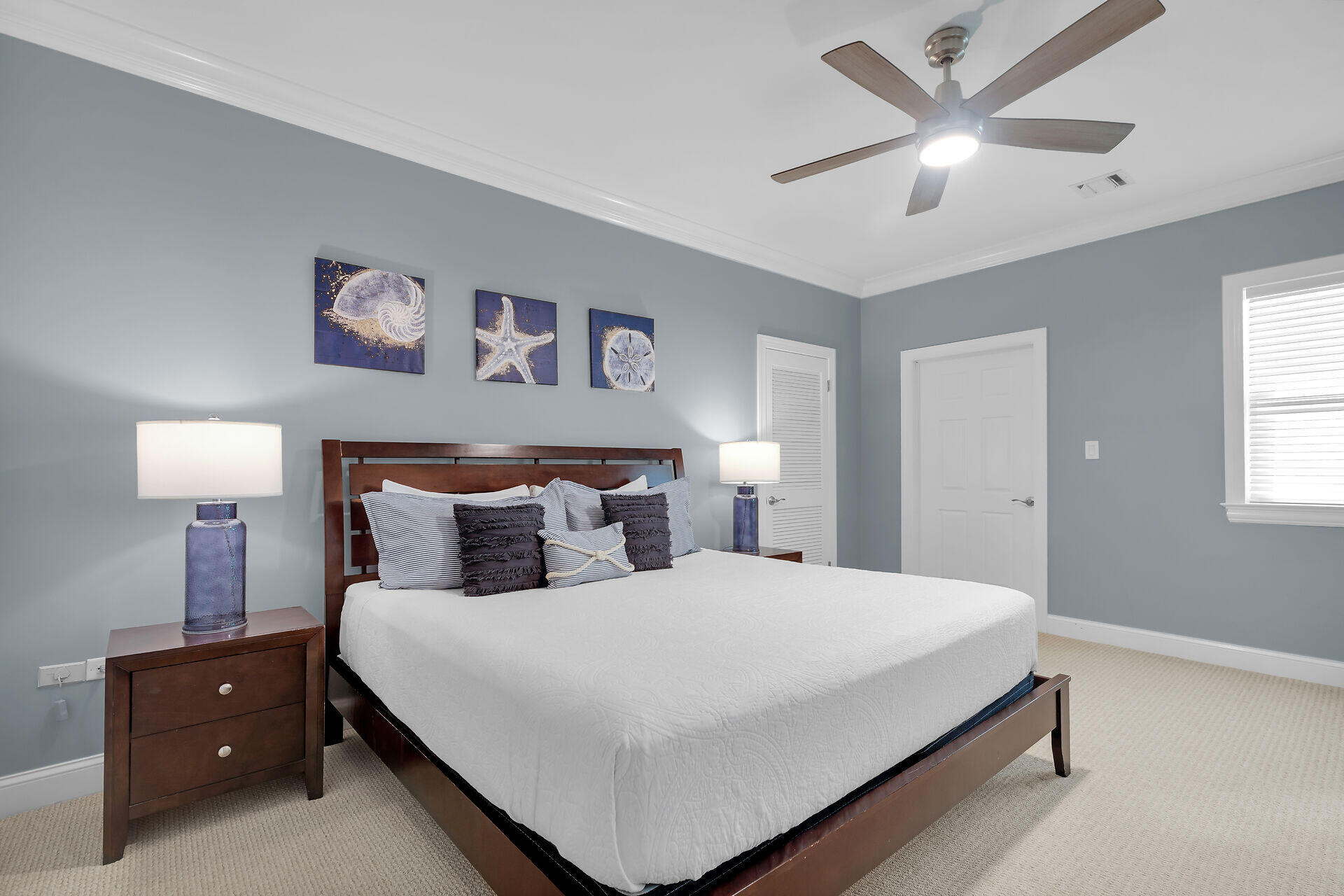 580-590 10th Street Key Colony Beach, FL 33051 - Photo 39 of 75 a bedroom with a bed and a lamp on dresser