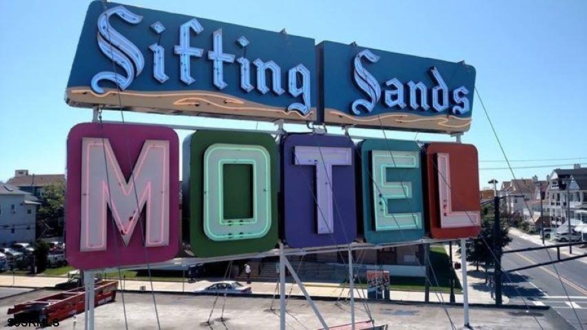 a front view of a building with retail shops