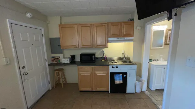 a view of a livingroom with furniture and windows