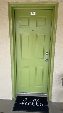 a living room with furniture and a lamp