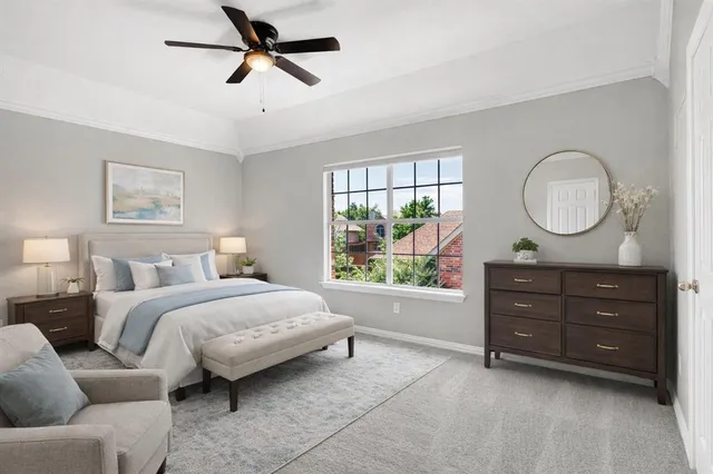 a bed room with a bed window and a mirror