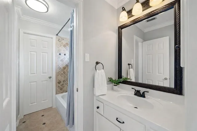 a bathroom with a sink a mirror and a shower